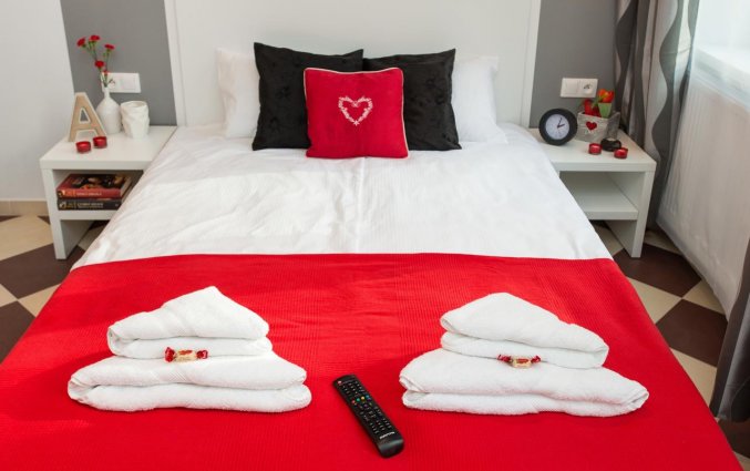 Bed van een appartement van appartementen Happy Tower Krakow in Krakau