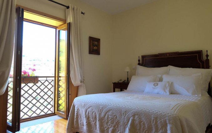 Tweepersoonsslaapkamer van Hotel Rural da Quinta do Silval in Noord-Portugal
