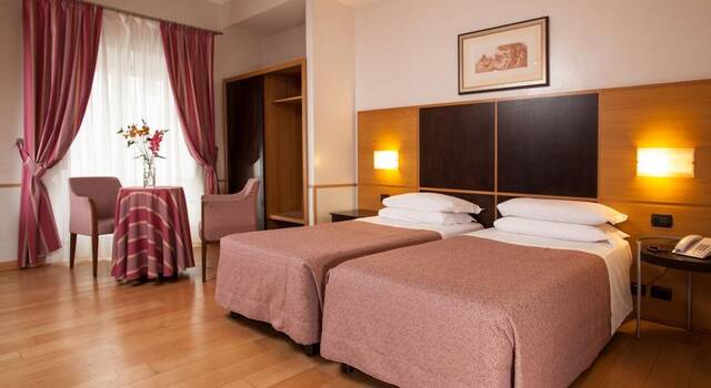 Slaapkamer van hotel Piemonte in Rome