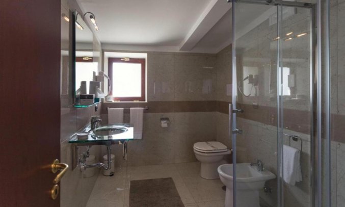 Badkamer van Hotel San Luca