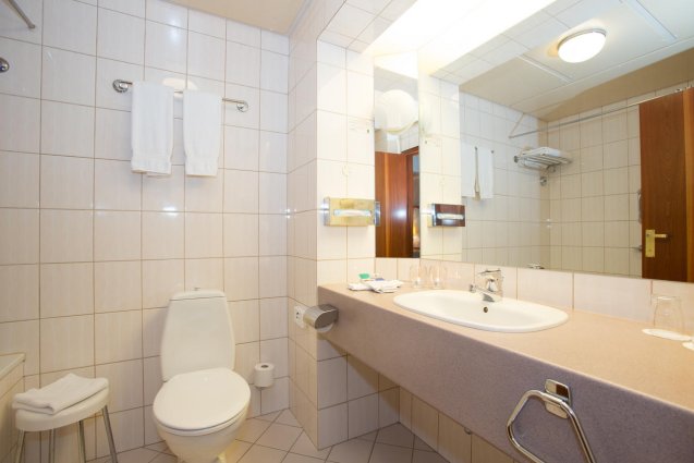 Badkamer van een tweepersoonskamer van Hotel Island op IJsland