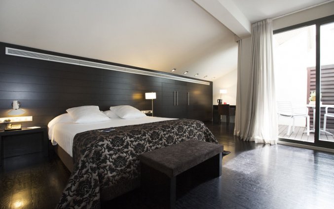 Slaapkamer van hotel Hospes Palau de La Mar in Valencia