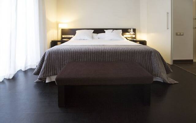 Slaapkamer van hotel Hospes Palau de La Mar in Valencia